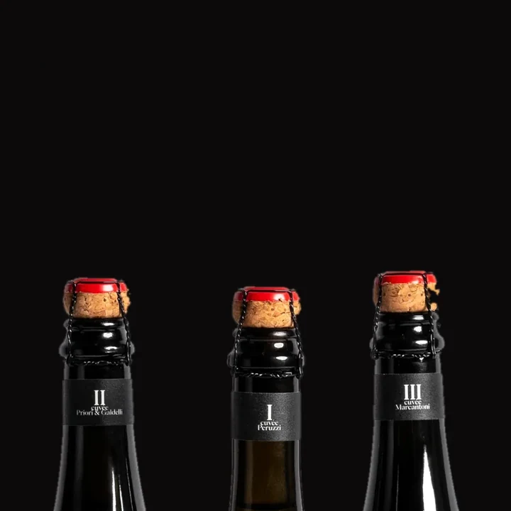 Three Anticelebration Cuvée bottles, I, II and III