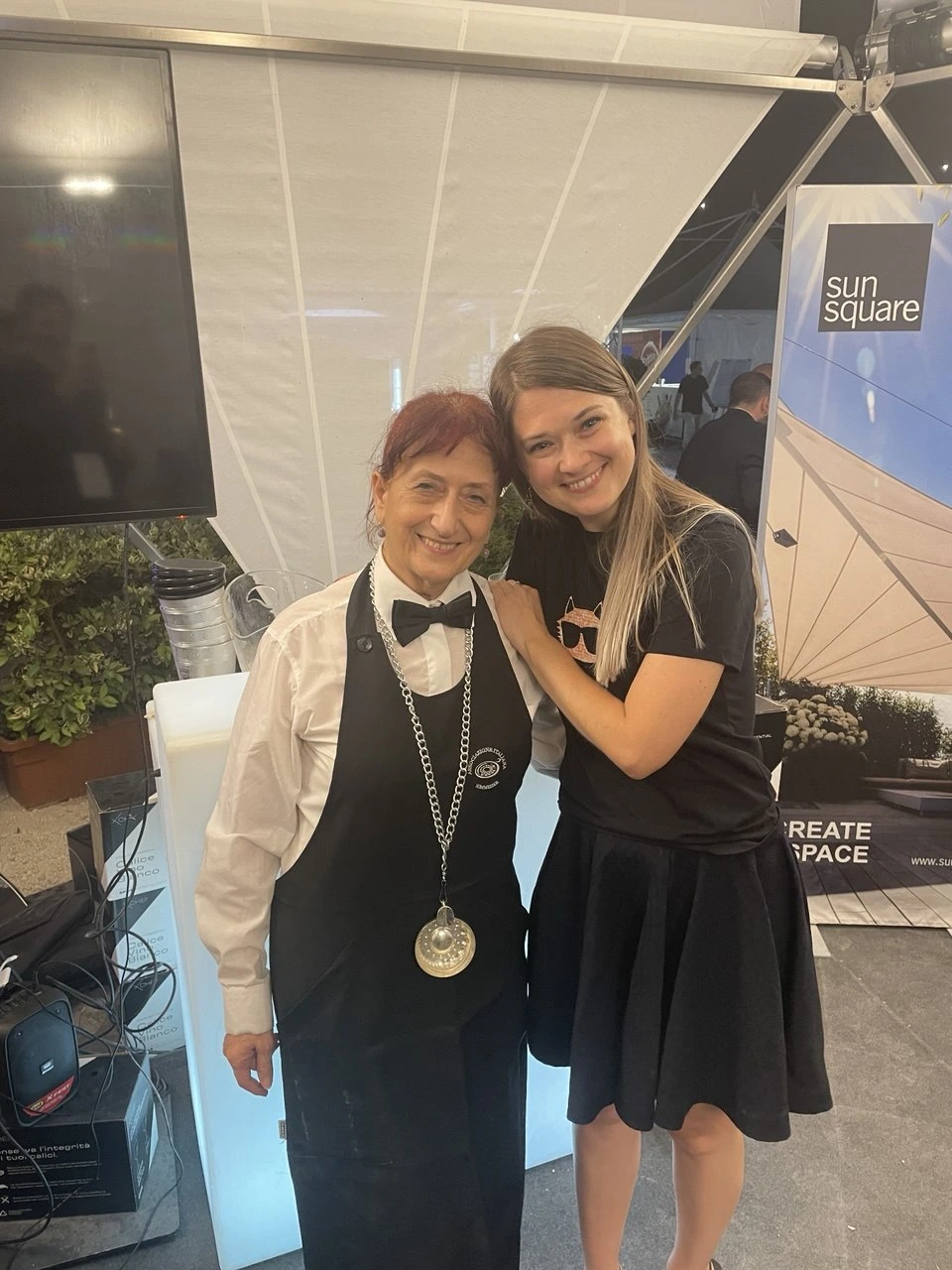 Elena with the sommelier at the stand