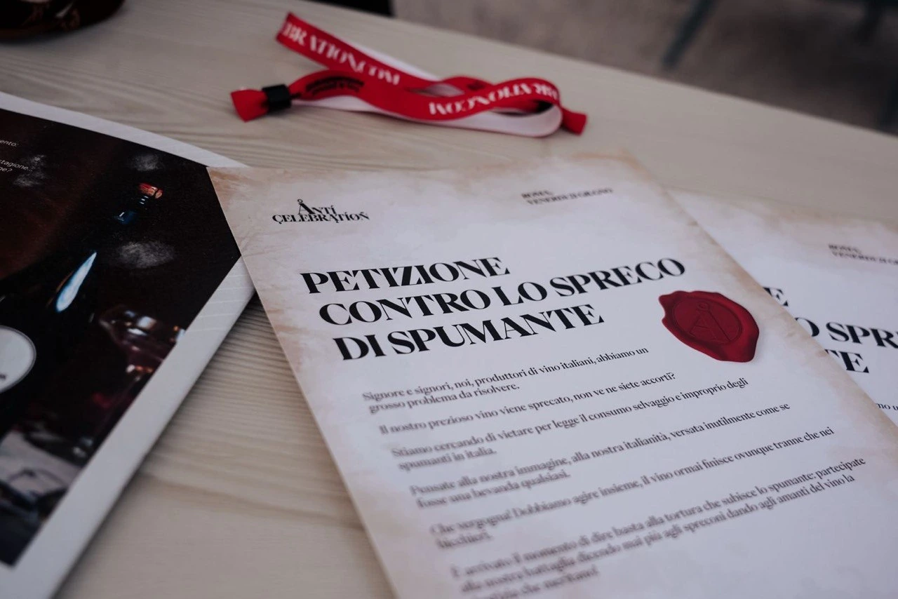 The petition against wasting sparkling wine, with Anticelebration wristbands