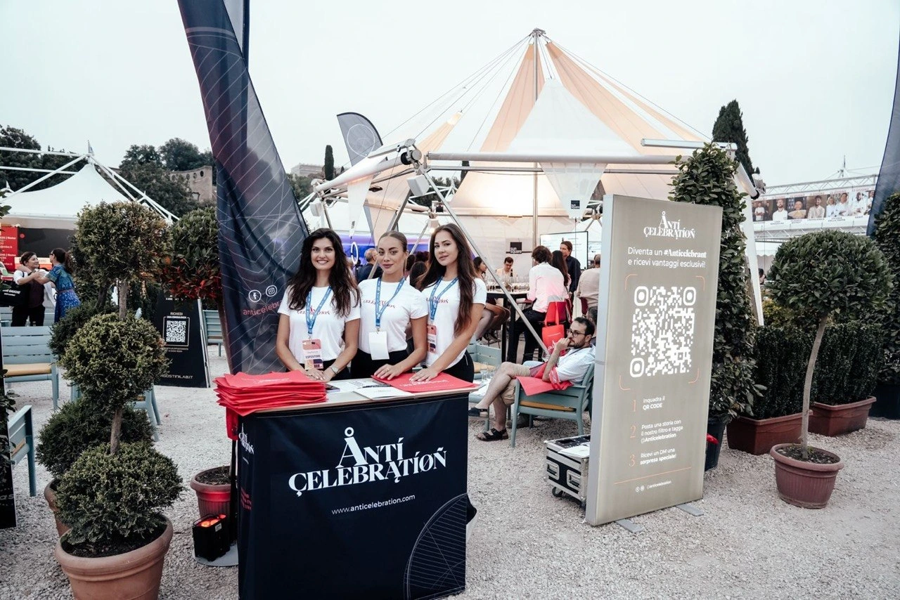 The Anticelebration stand with the team